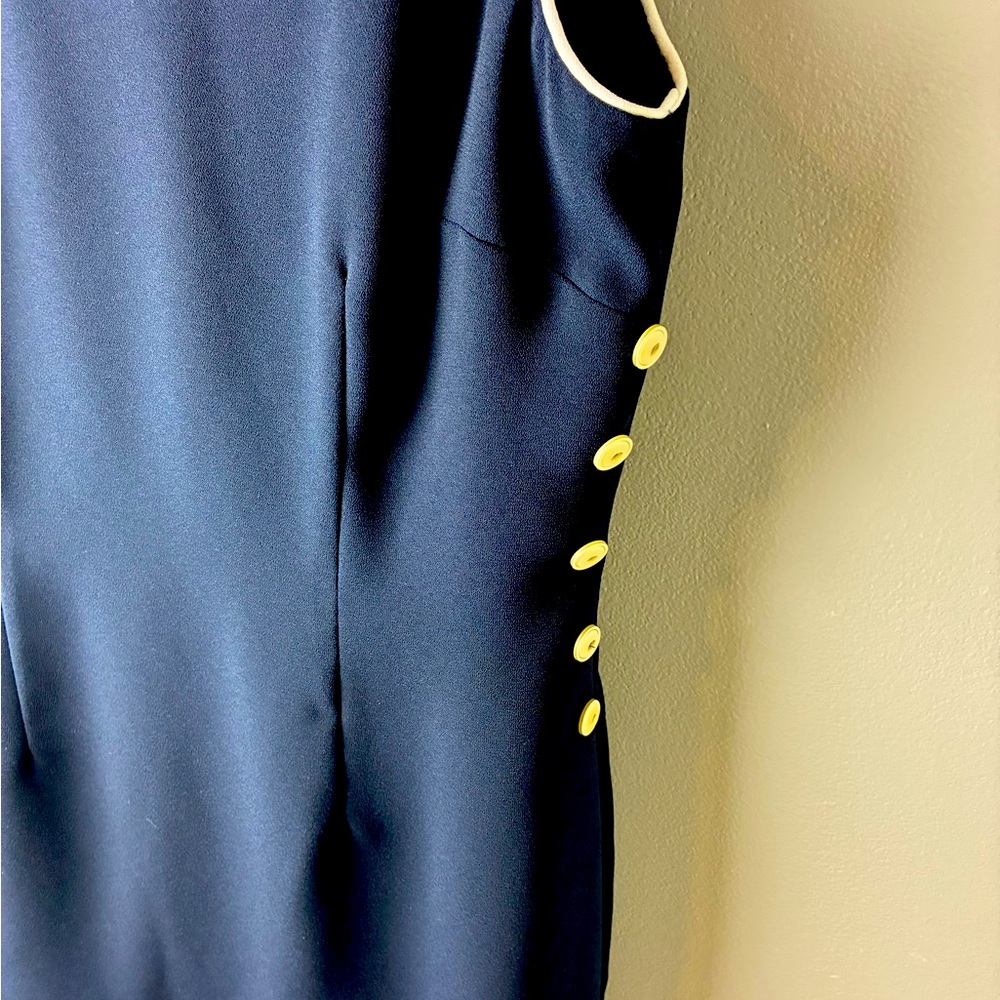 CDC Y2K Elegant Navy dress with white details , bottoms on one side. side.